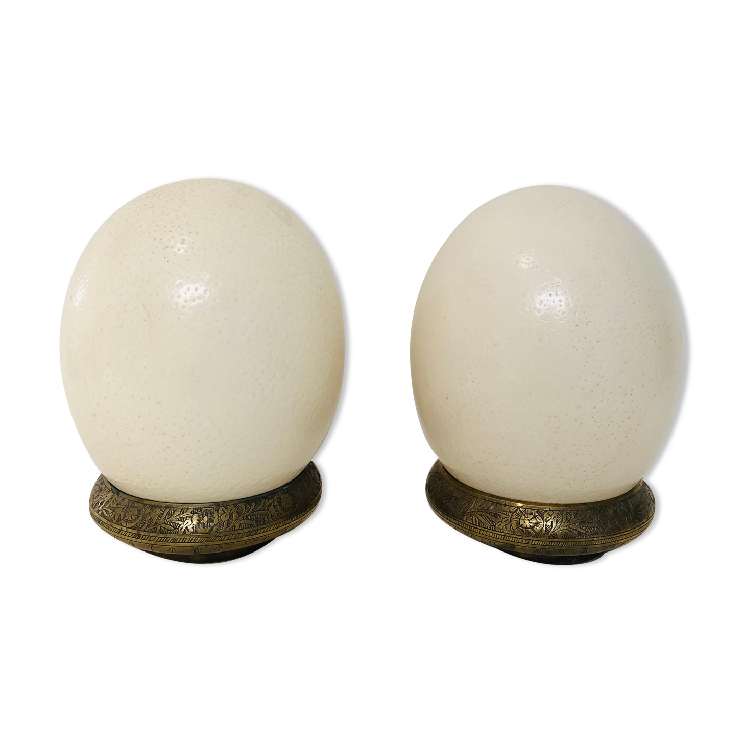 Pair of ostrich eggs on base, early 20th
