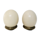 Pair of ostrich eggs on base, early 20th