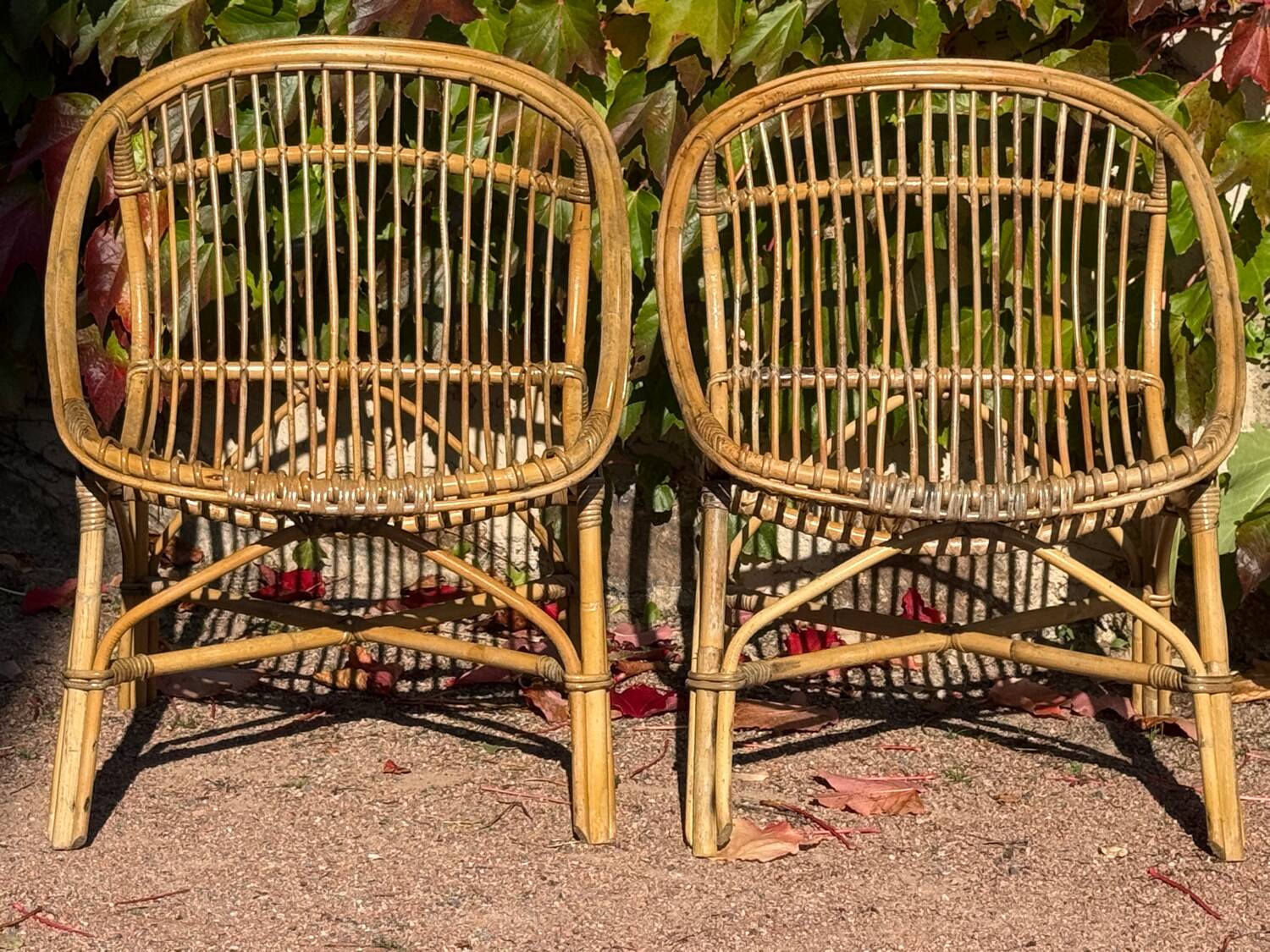 Pair of 1950s rattan armchairs from France.