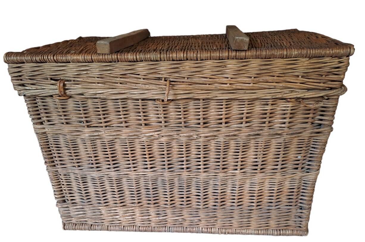 Wicker travel trunk XIX with metal clasps and handles.