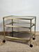 Vintage glass and brass side table