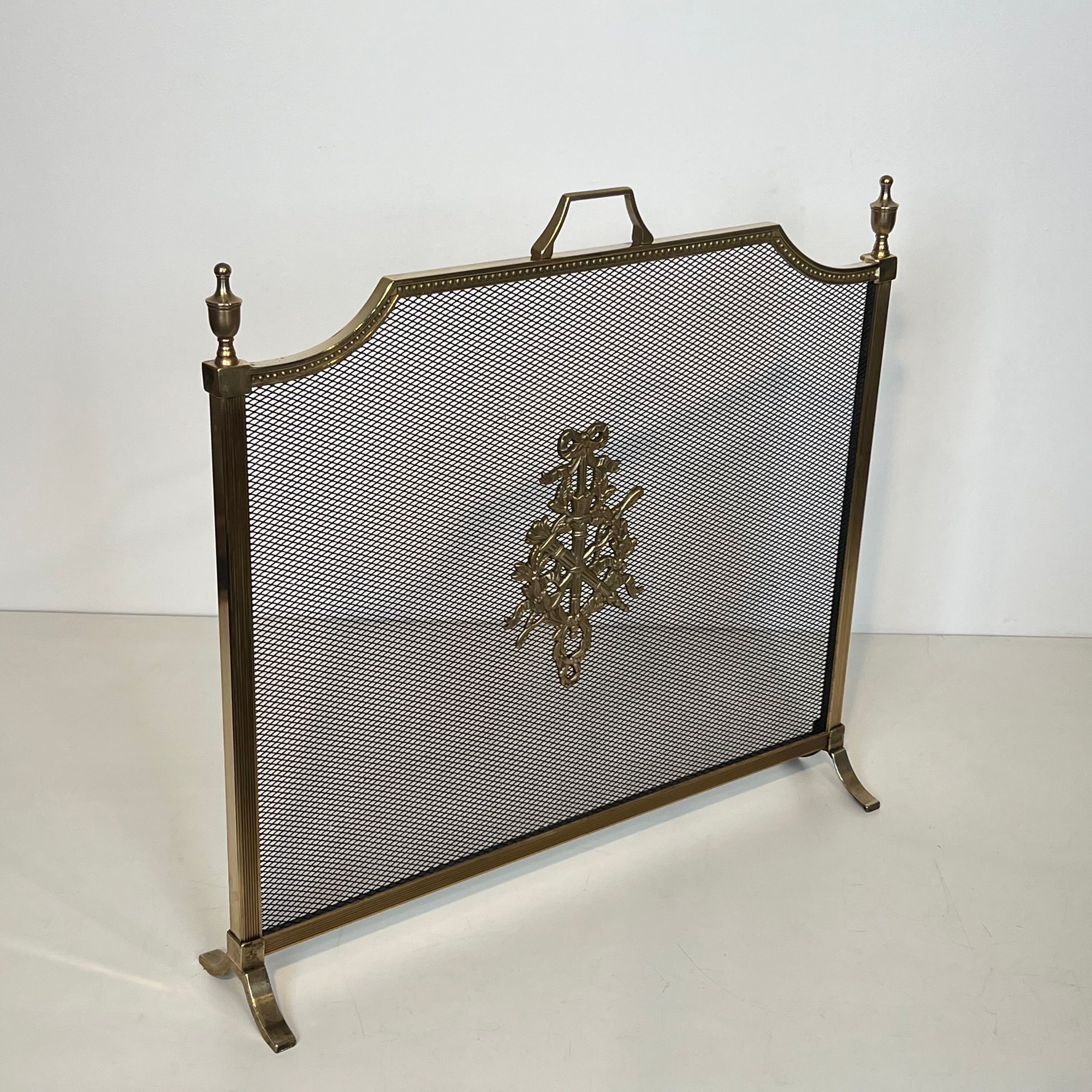 Brass fire screen and grille in the Louis XVI style in the taste of Maison Jansen.
