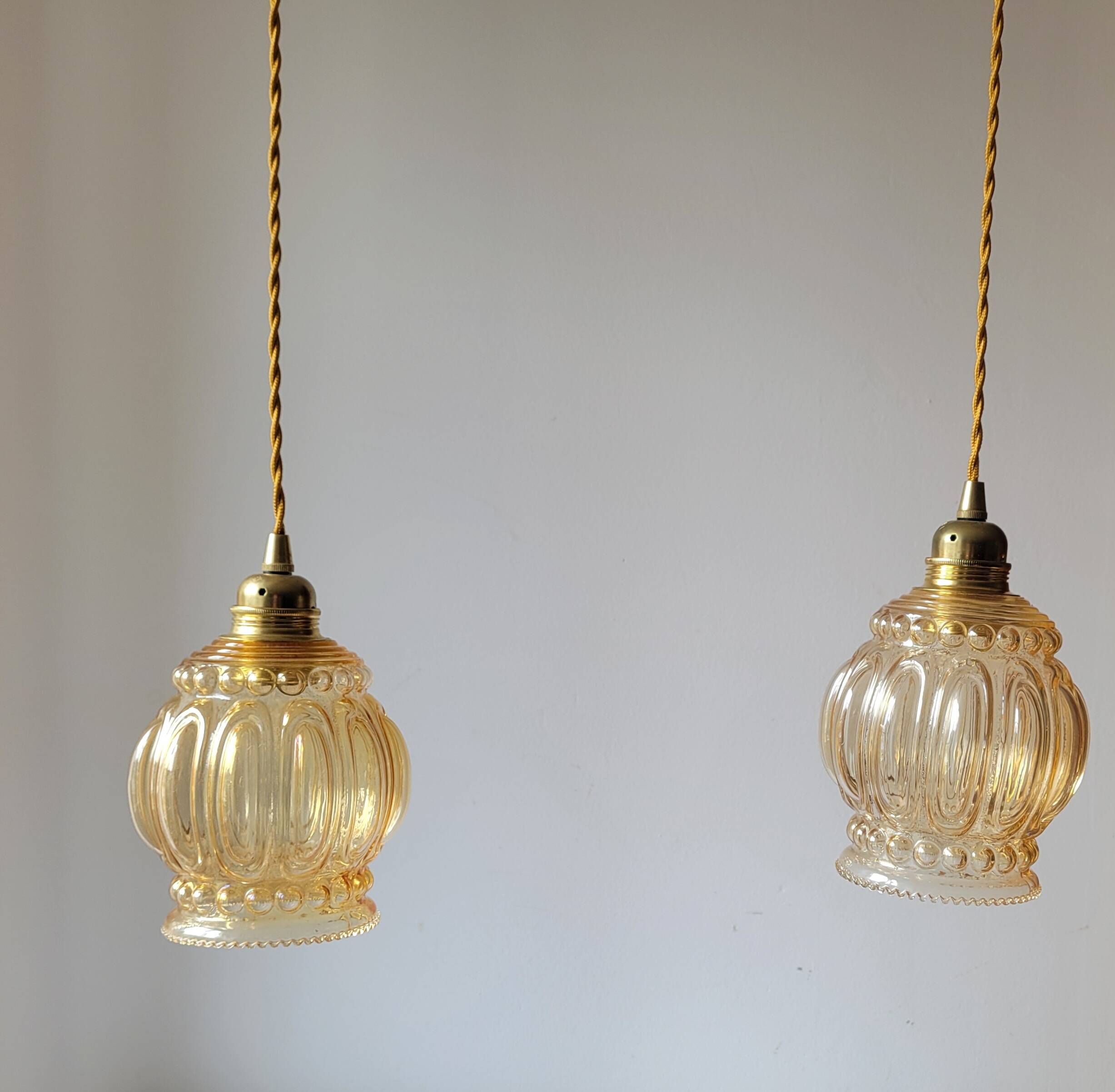 Duo of amber molded glass pendant lights