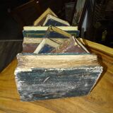 side table, end of sofa stack of wooden books, old, beautiful patina