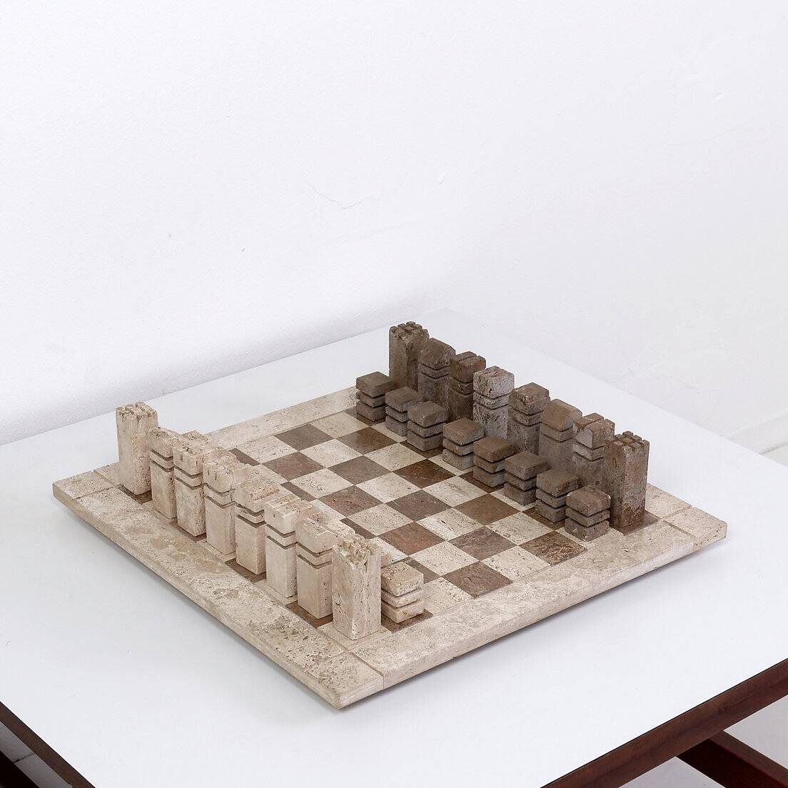 Modernist two-tone travertine chess set, Italy, 1970s