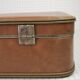 Cardboard and brown leather case