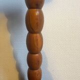 Round tripod stool in carved wood