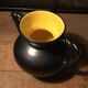Iridescent black and yellow ceramic vase