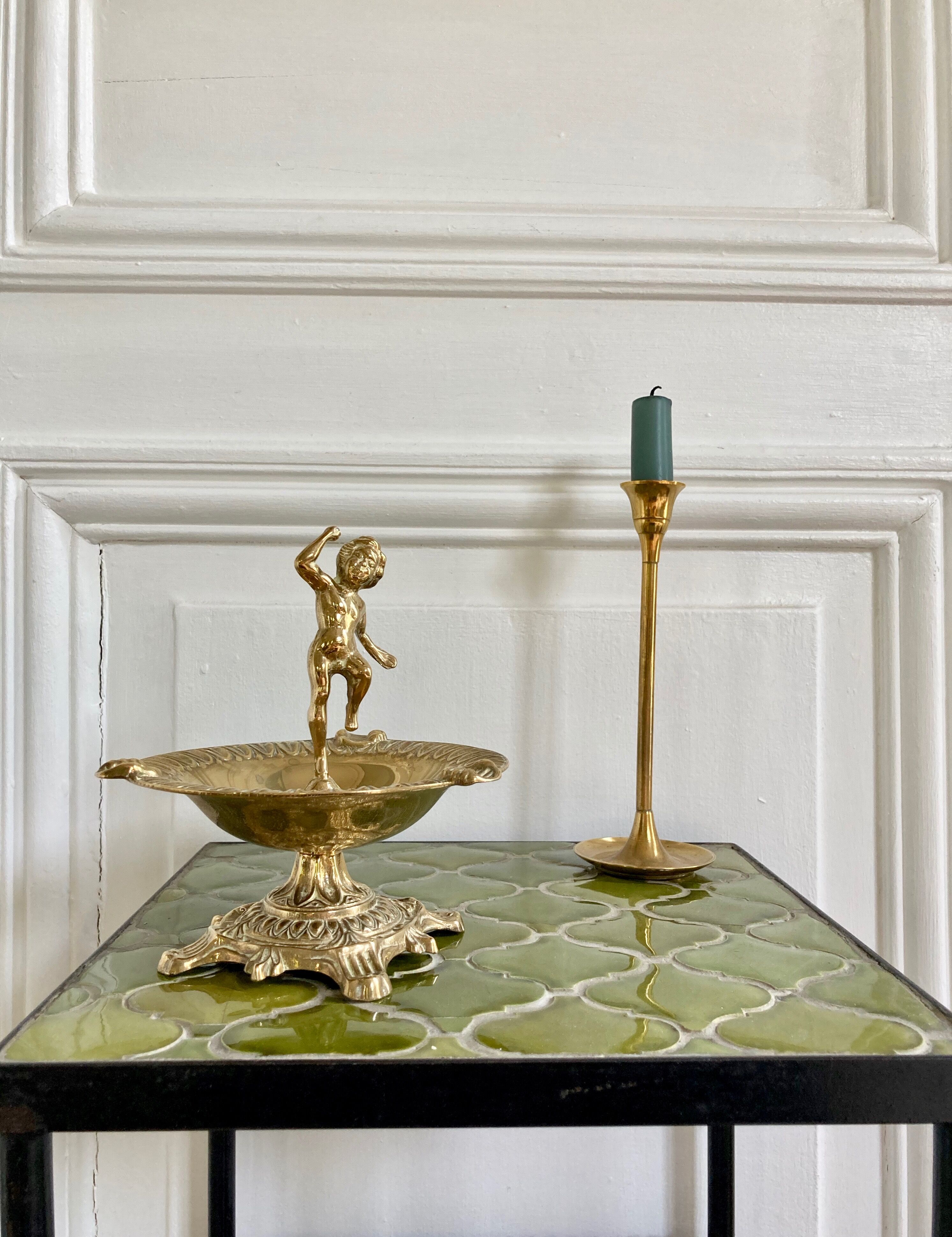 Brass cherub pocket-empty ashtray