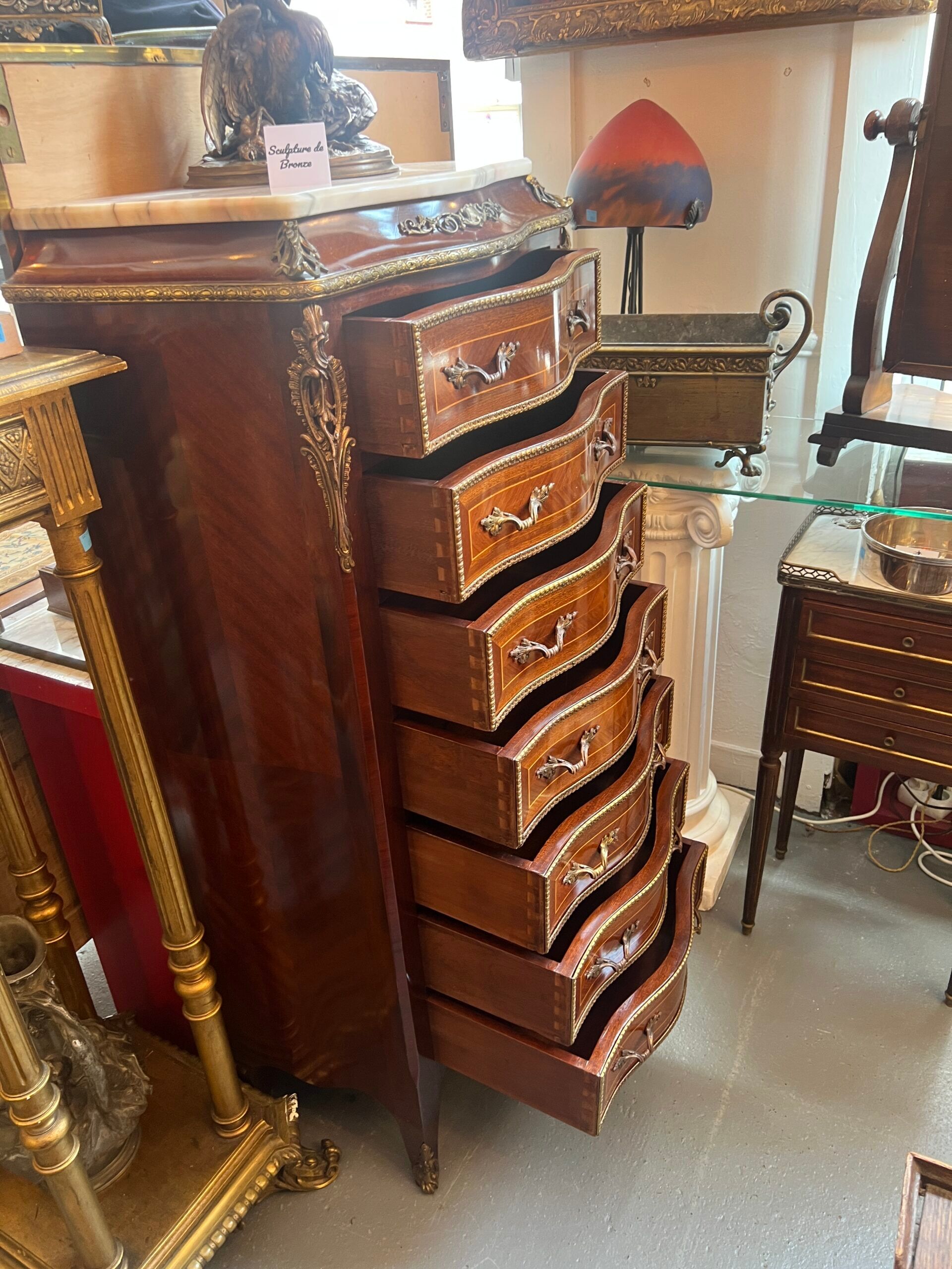 Weekly chest in wood veneer, curved and eventful shape, 20th century period