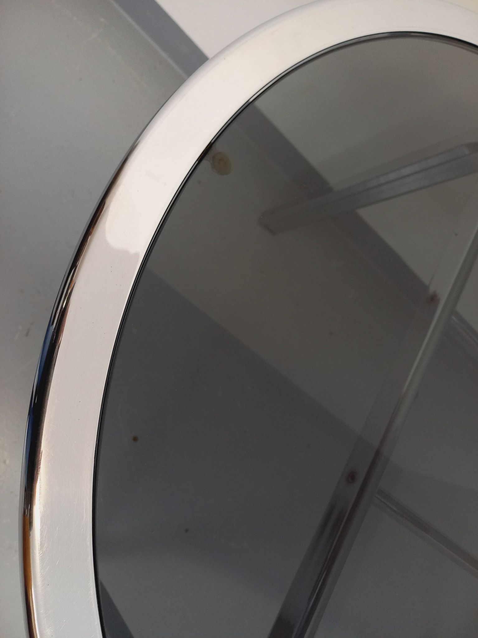 Vintage oval dining table in smoked glass and chrome metal, Space Age style.