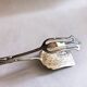 Wrought silver plated cake clips