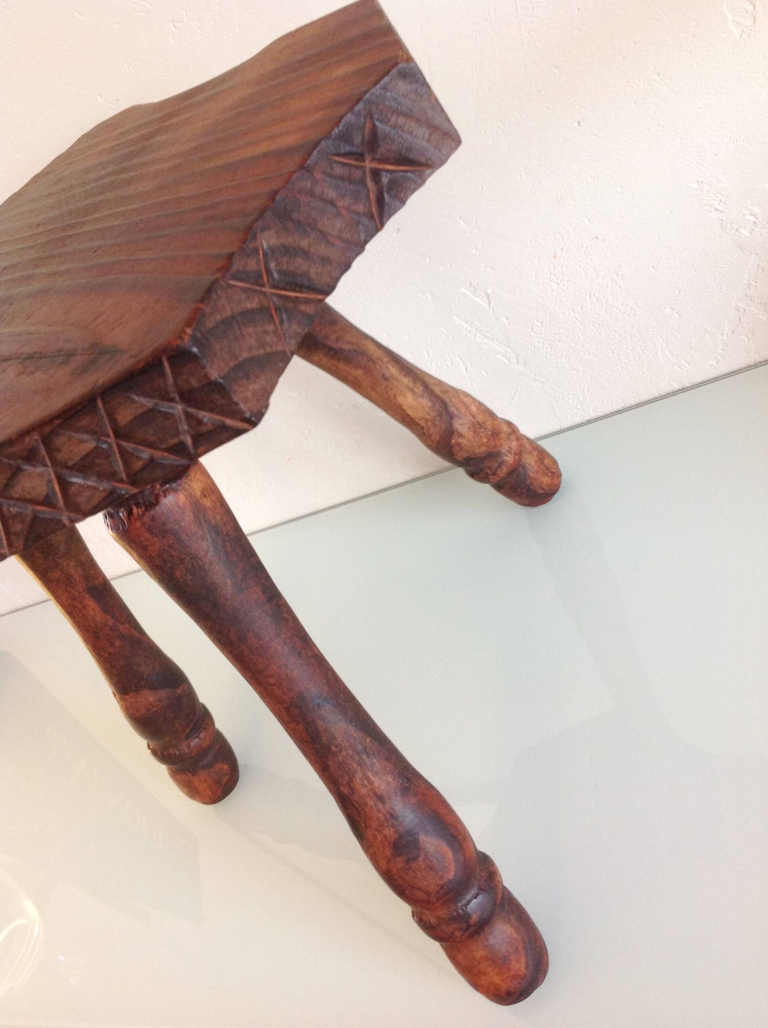 Vintage brutalist wooden tripod stool from the 60s and 70s