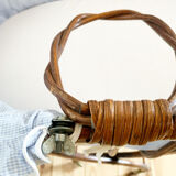 Vintage rattan cradle and its wheeled support