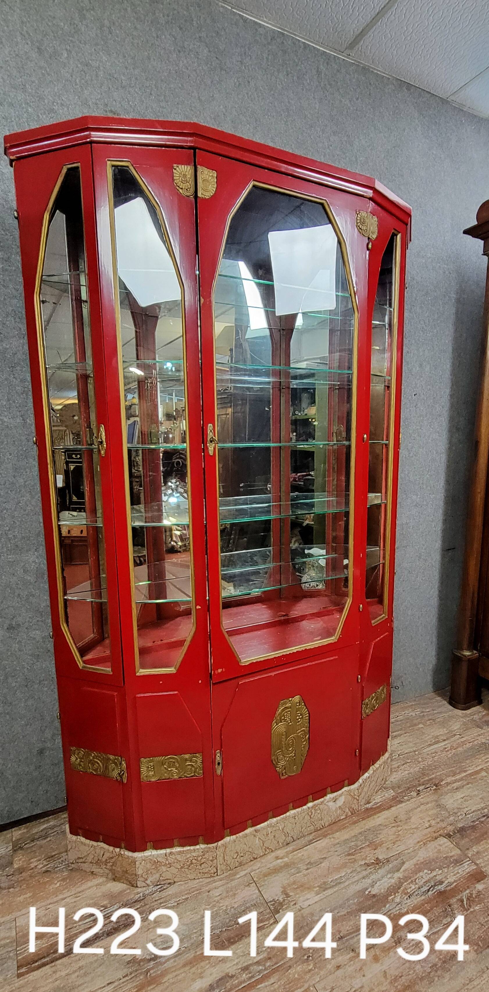 Important Art Deco period bookcase in lacquered wood and gilded bronze