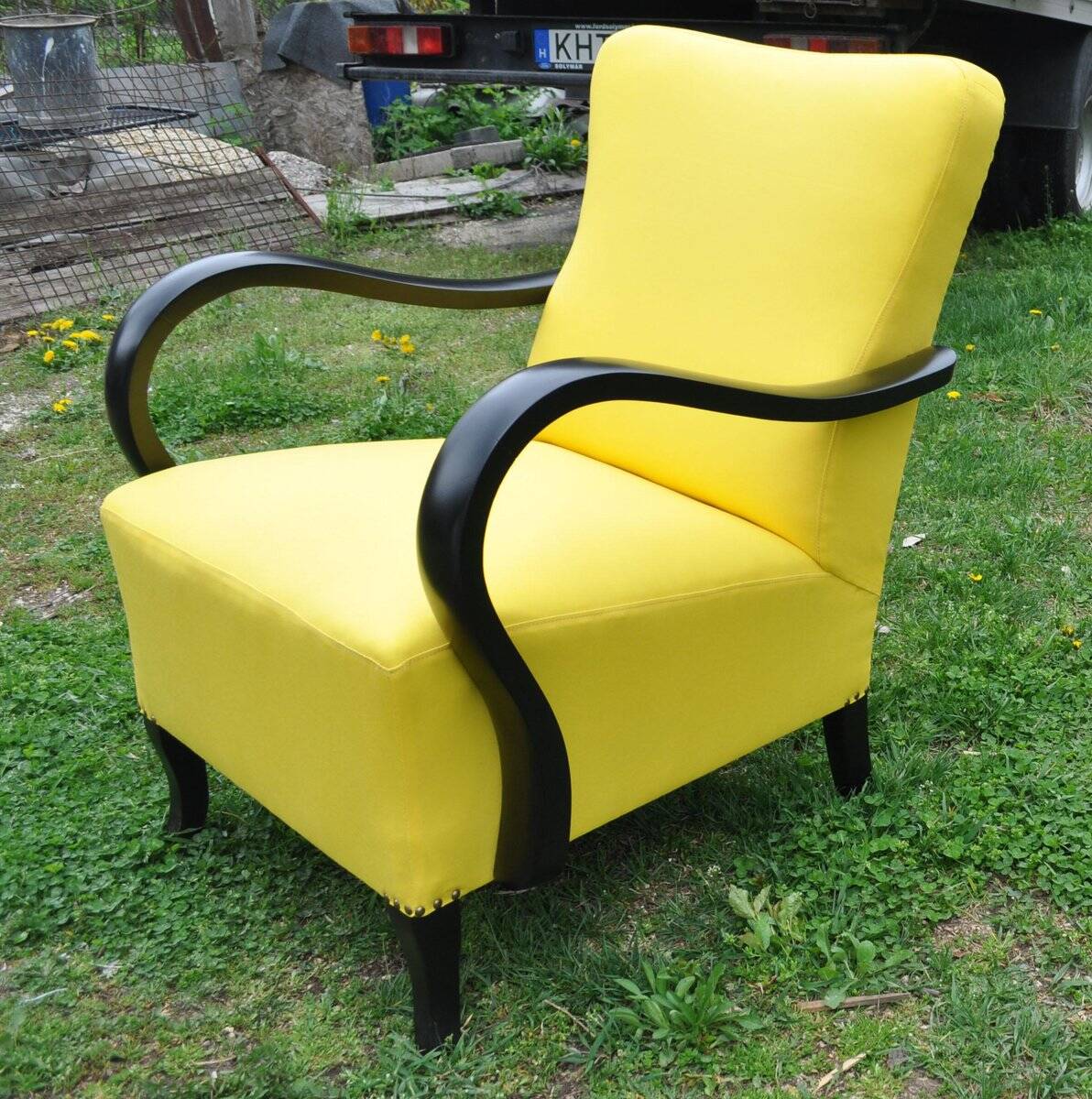 Art Deco armchair in yellow and black, made of painted wood and cotton, high back, 1920s.