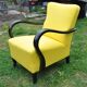 Art Deco armchair in yellow and black, made of painted wood and cotton, high back, 1920s.