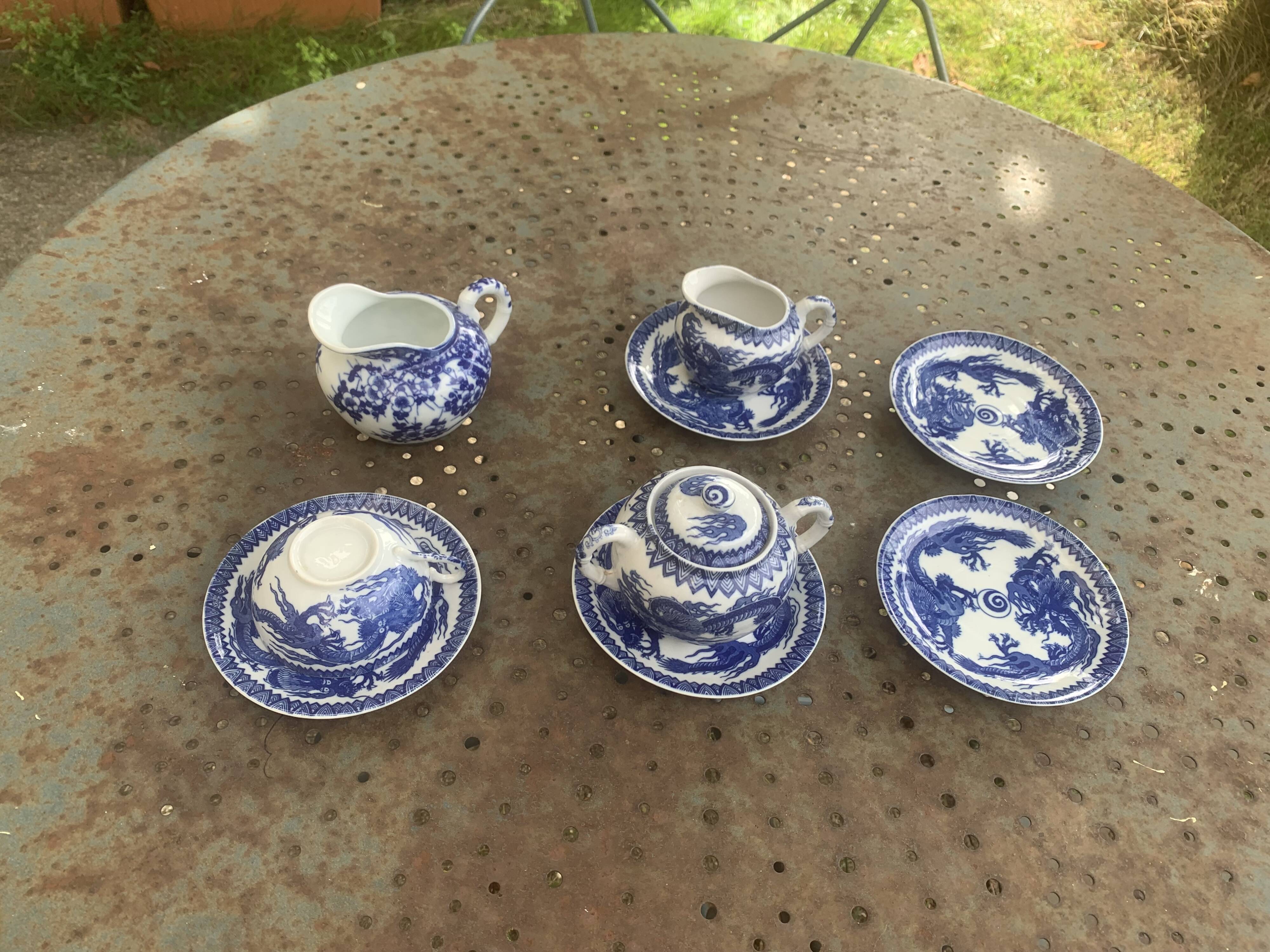 Porcelain tea set with dragon or cherry blossom motif