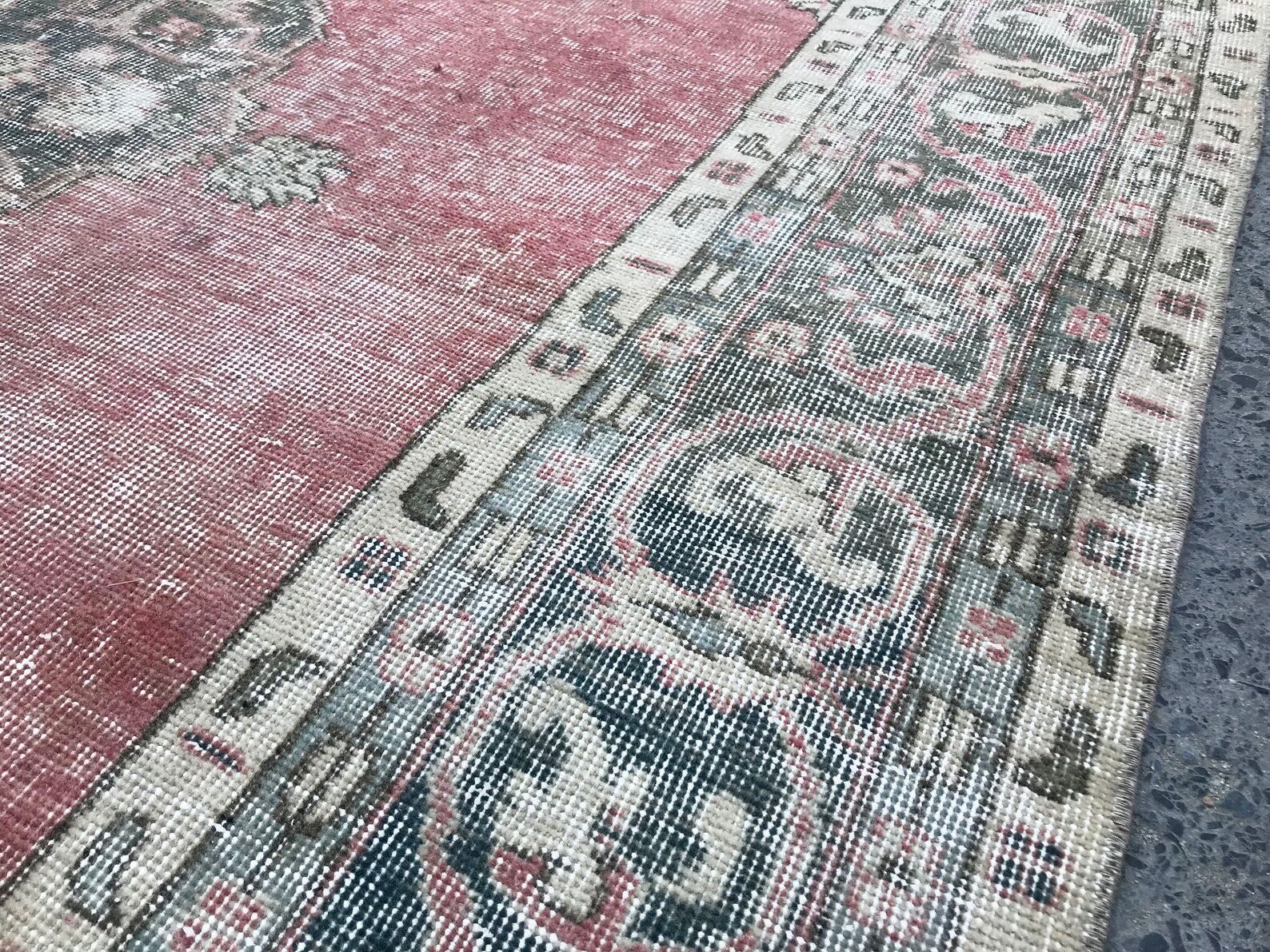 Pale pink rug with medallion