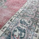 Pale pink rug with medallion