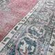 Tapis rose pâle avec médaillon