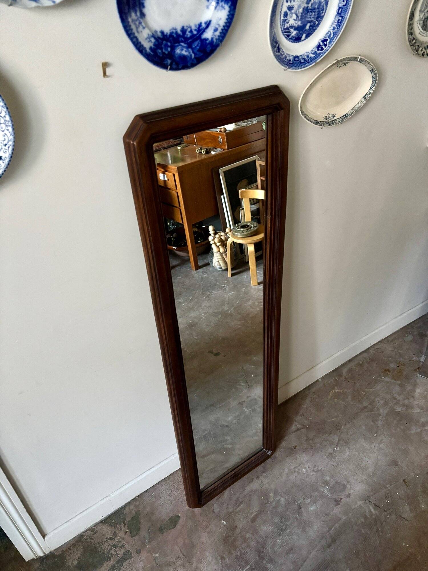 Full-length rectangular mirror in dark wood