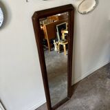 Full-length rectangular mirror in dark wood