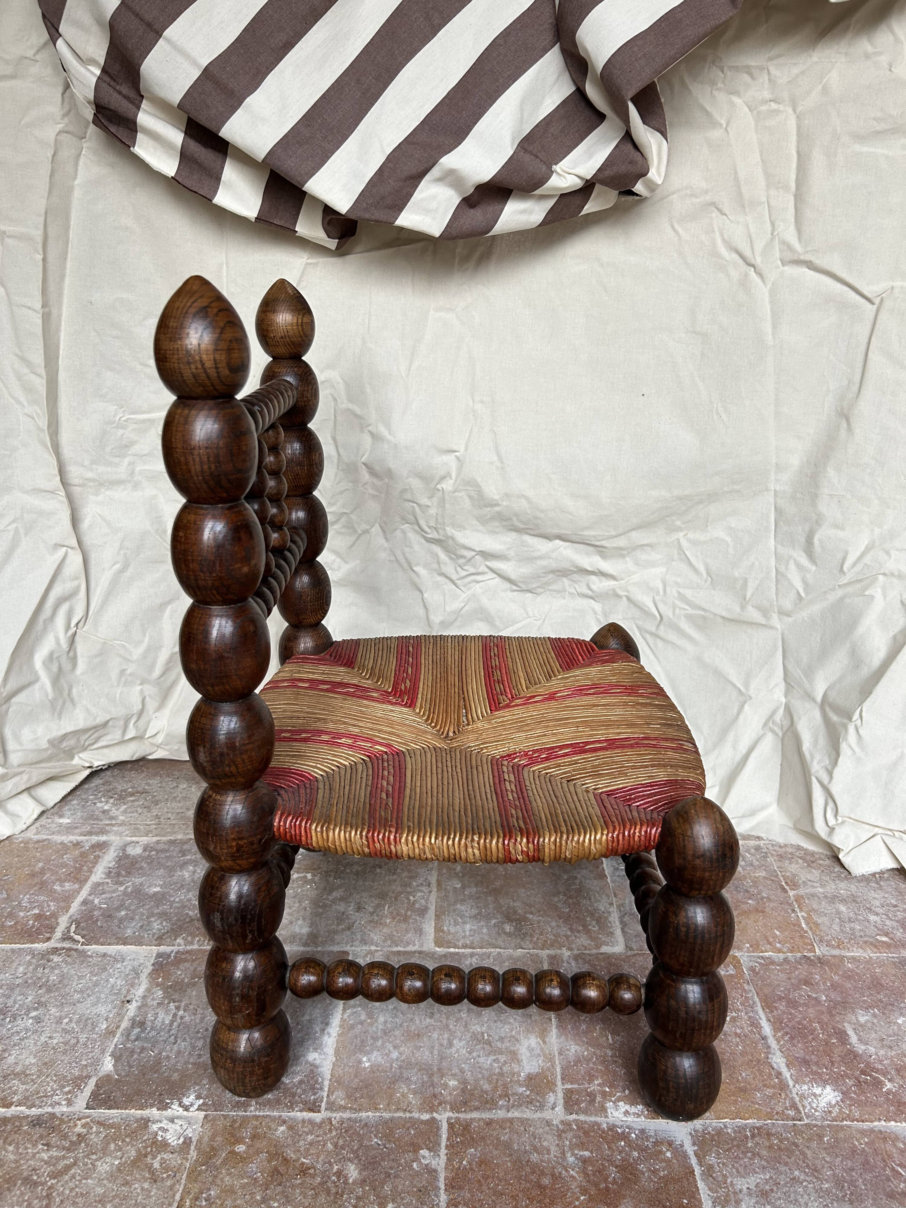 Turned wooden chair by Charles Dudouyt