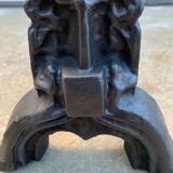 Pair of cast iron chenets with stylized faces High Epoch SEVENTEENTH century