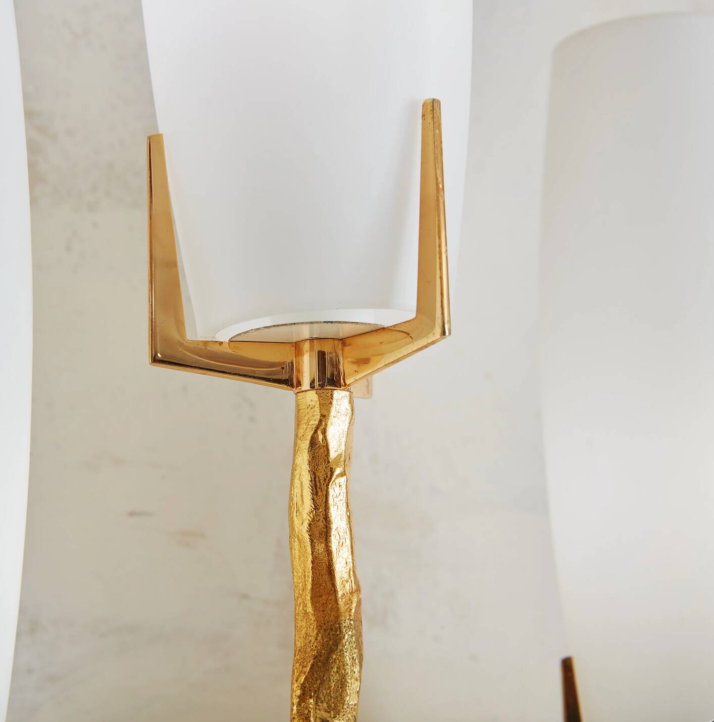 Pair of wall lights by Maison Arlus by Felix Agostini in bronze.