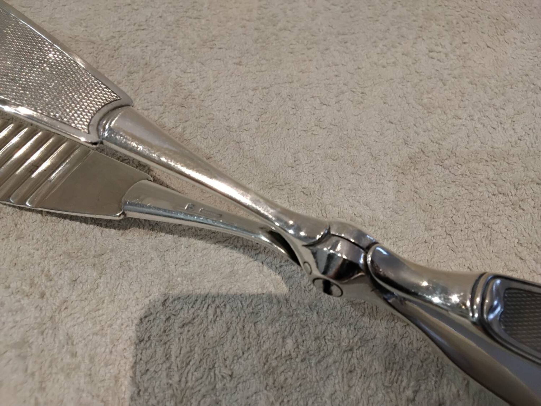 Silver-plated asparagus tongs with guilloche decoration and goldsmith Christofle