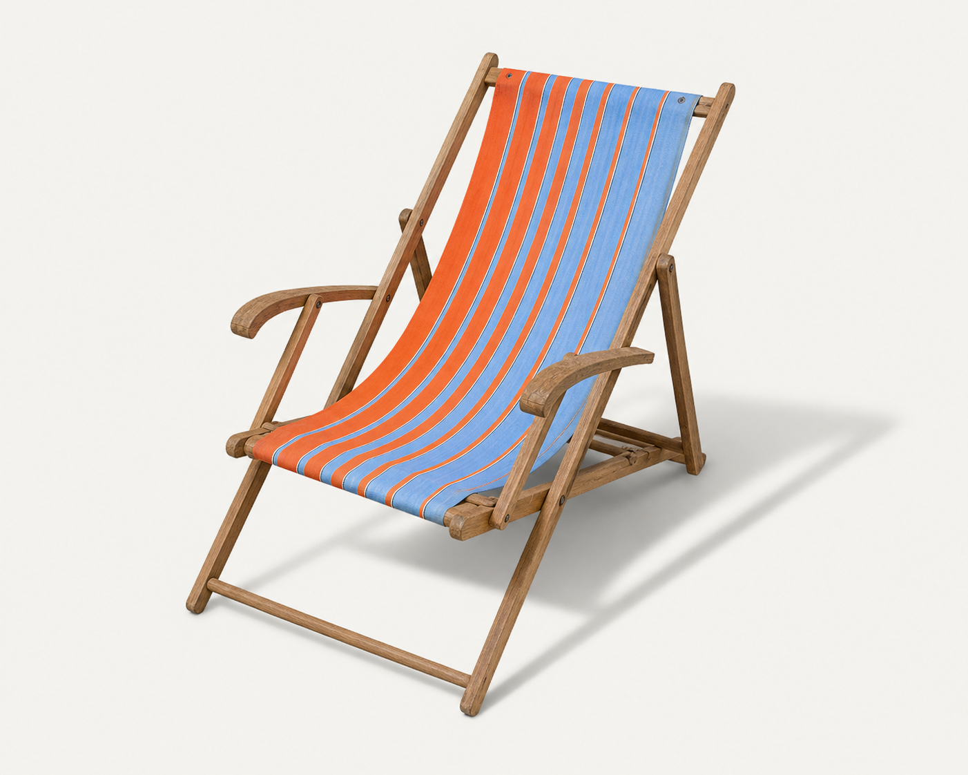 Vintage deck chair with orange and blue striped fabric, original patina.