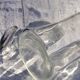 Two antique engraved glass bottles