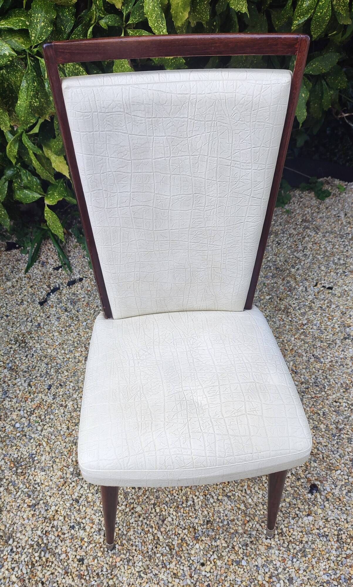 Set of 4 Vintage Mid-Century Modern Chairs with tapered metal legs.