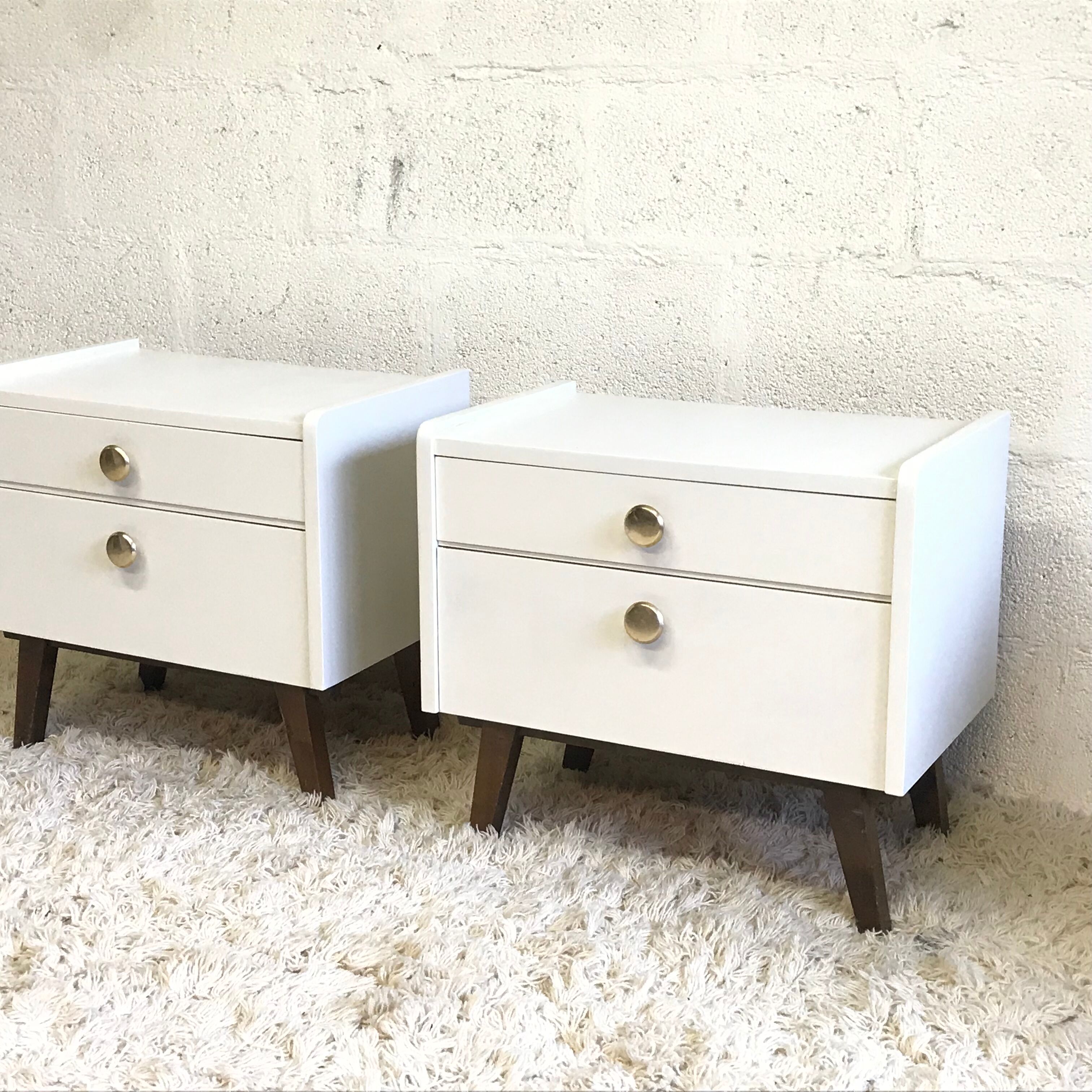 Pair of bedside tables with compass feet