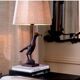 Pair of patinated bronze table lamps depicting a falcon