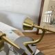 Pair of wall sconces in brass with white glass tulips.