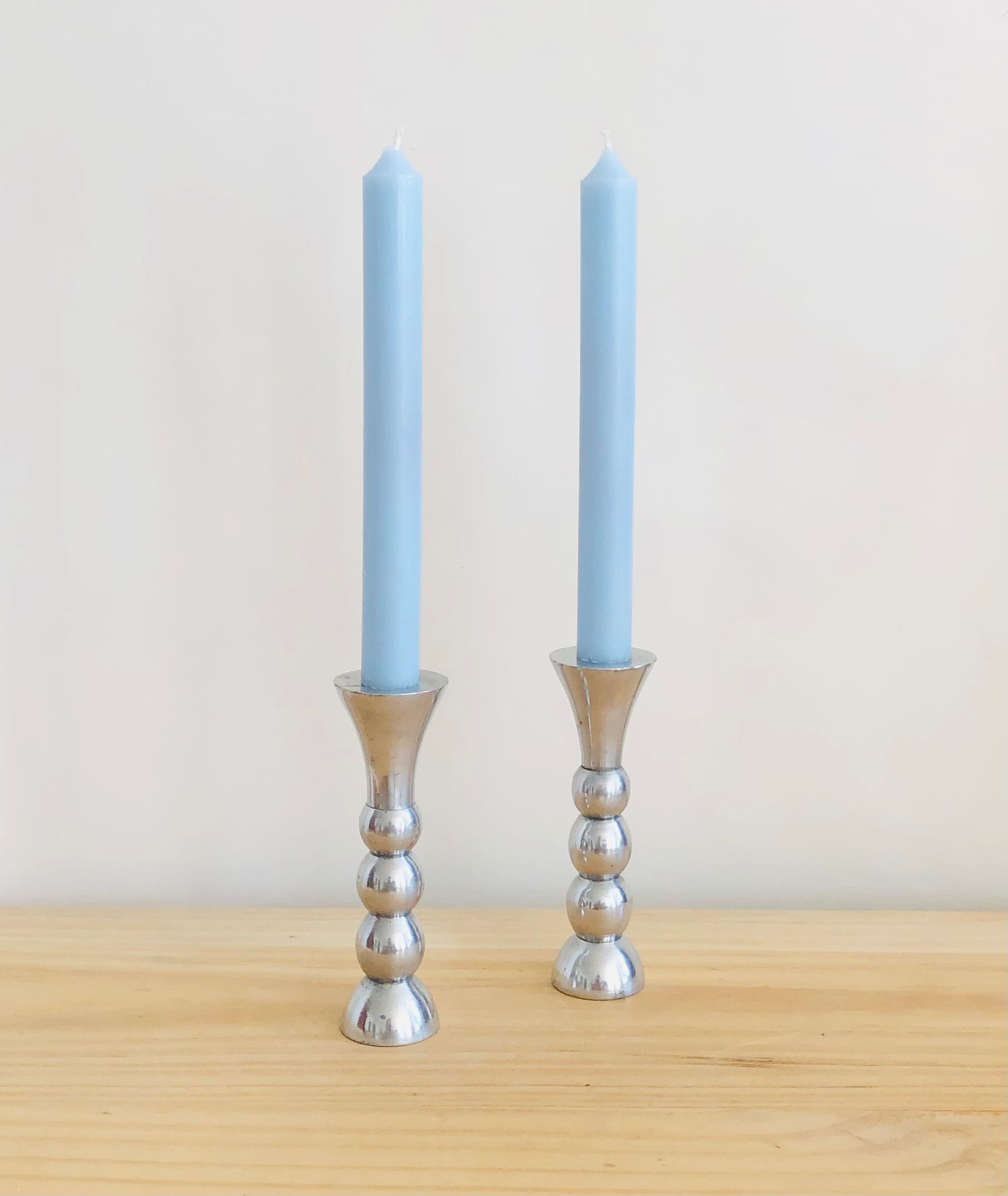 Pair of vintage cast aluminum candle holders