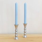 Pair of vintage cast aluminum candle holders