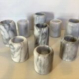 Nine marble candlesticks