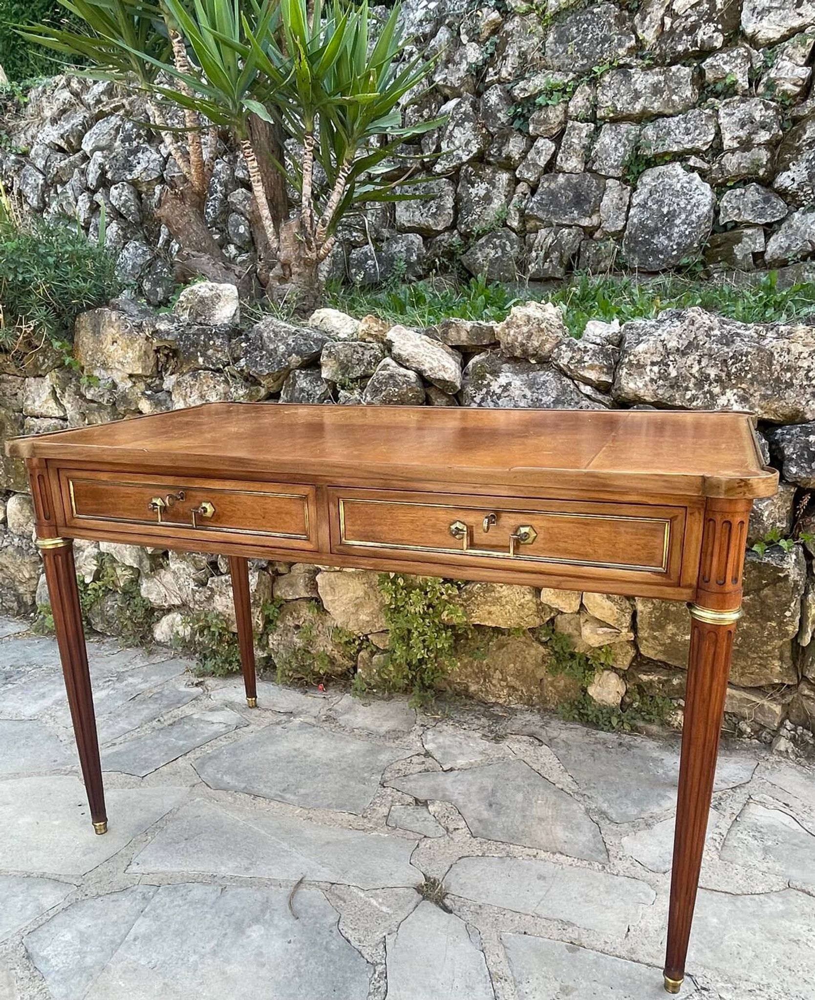Louis XVI style mahogany flat desk from the late 19th century
