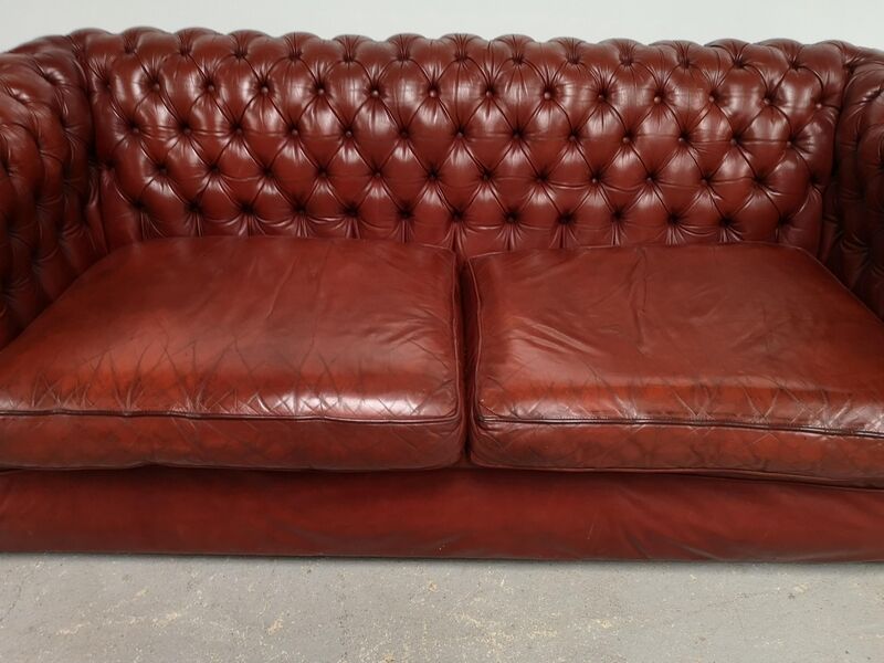 Old red leather Chesterfield sofa