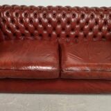 Old red leather Chesterfield sofa