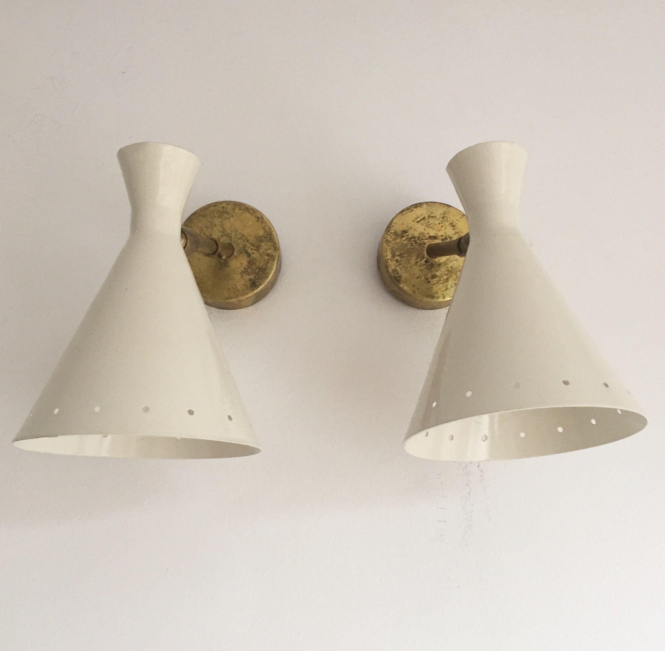 Pair of white and brass sconces