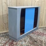 Showcase with sliding doors in painted wood
