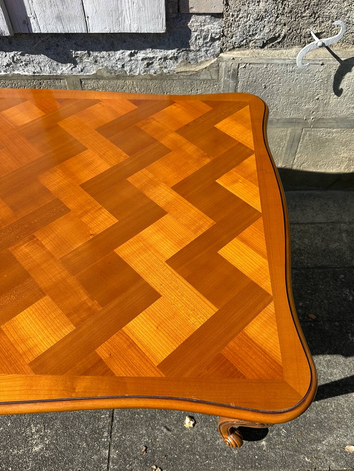 Antique extendable table in cherry wood and marquetry in the Louis XV style.