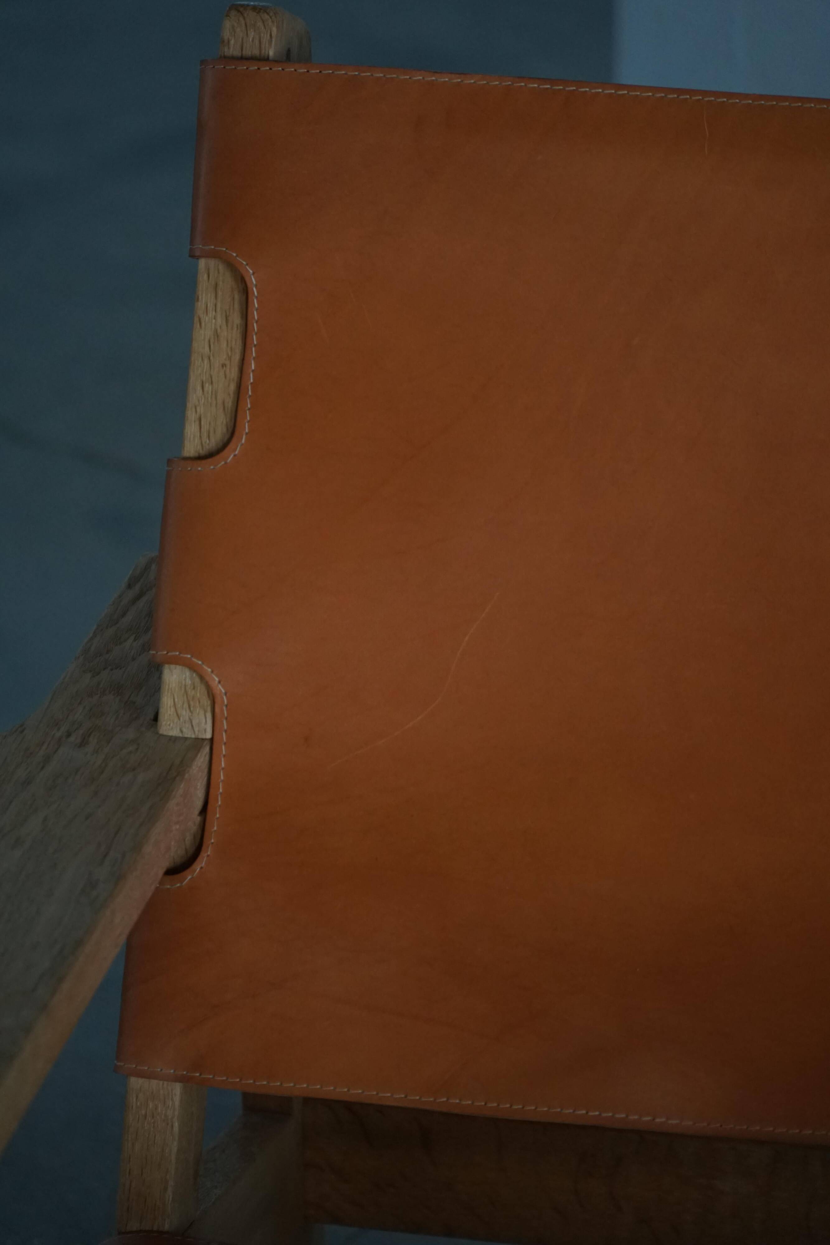 Pair of oak and leather hunting chairs by Kurt Østervig, modern Danish style from the 1960s.