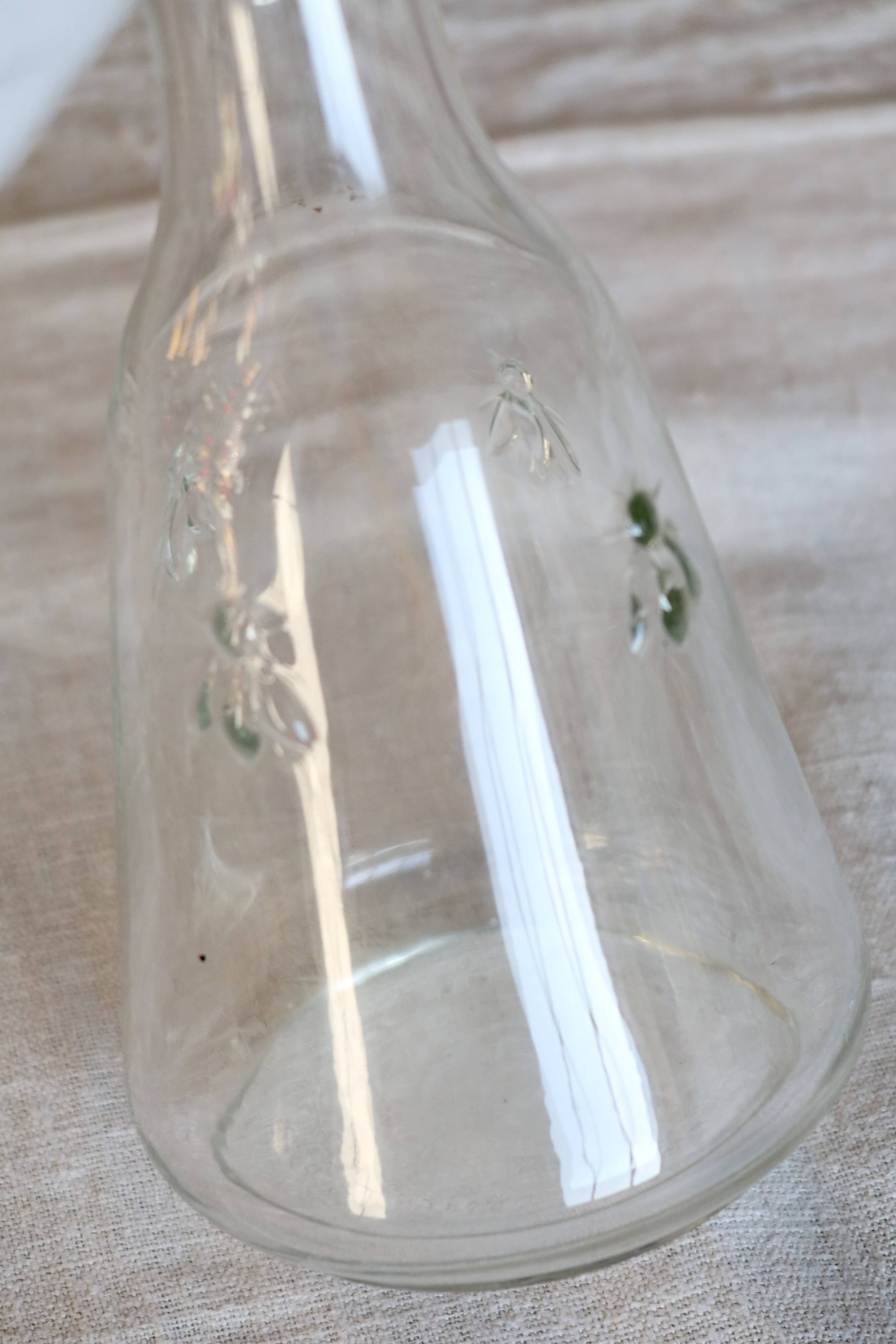 Vintage glass carafe with embossed bee motifs