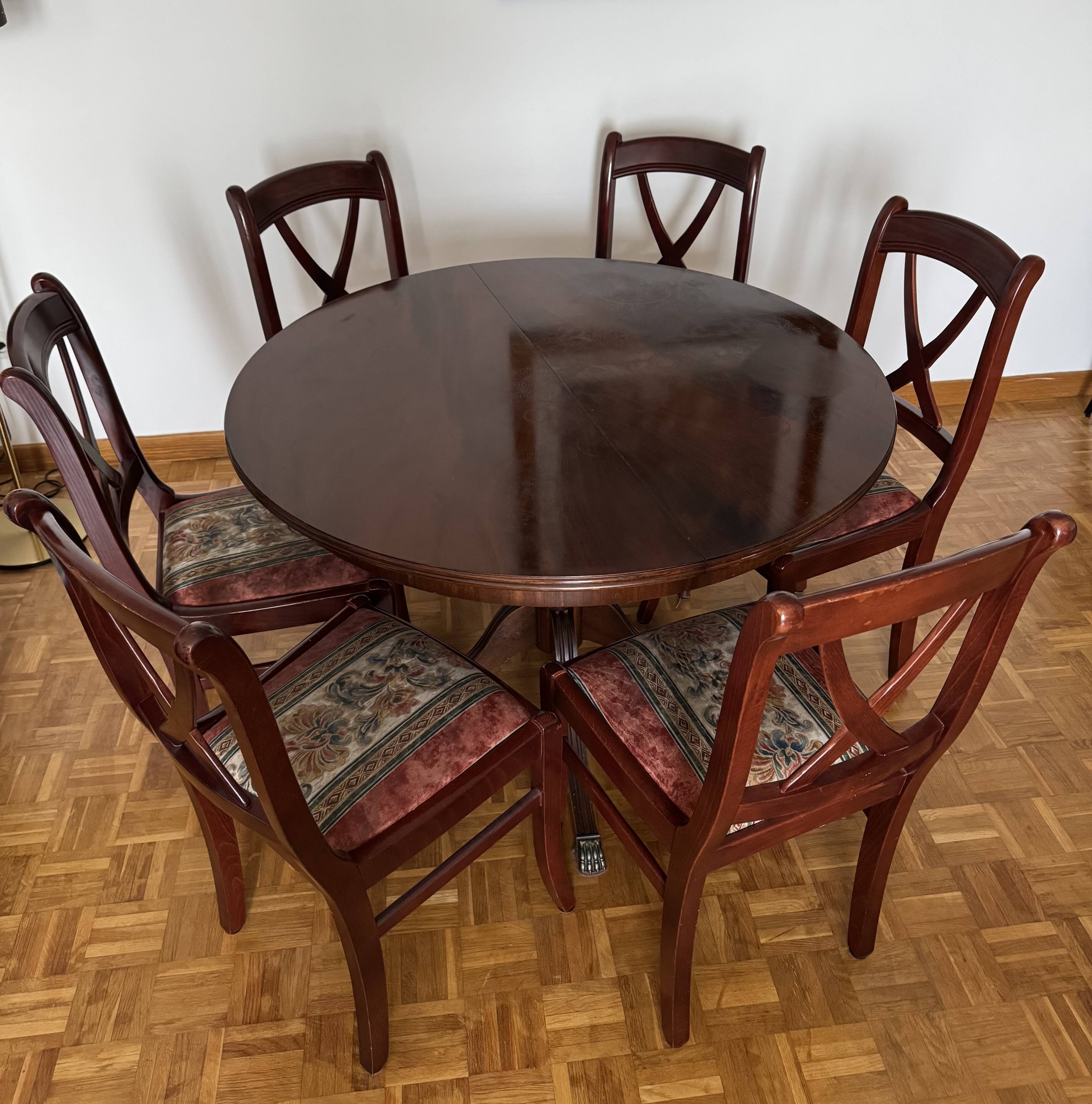 Round mahogany table and beech chairs.