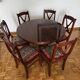 Round mahogany table and beech chairs.